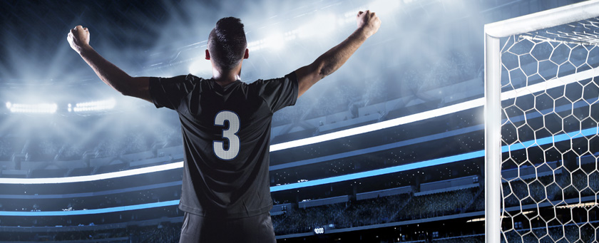 Pic of player after scoring a goal in a big stadium